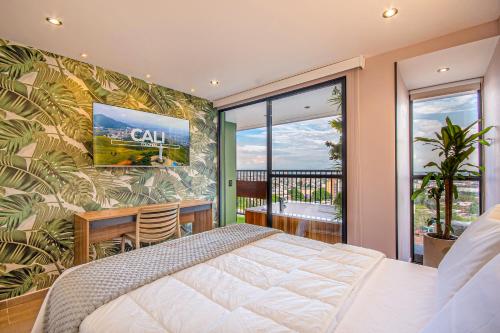 a bedroom with a bed and a large window at Edificio Habitare Cristales Cali 2 in Cali
