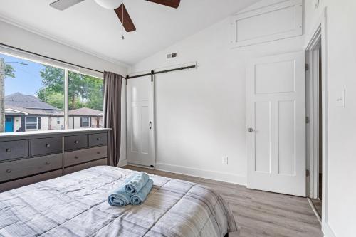 a bedroom with a bed and a large window at Inviting Home 312D Close to Charlottes Uptown in Charlotte