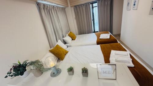 Postel nebo postele na pokoji v ubytování R Inn 本町 R-Inn Hommachi