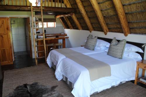 A bed or beds in a room at Ko Ka Tsara Bush Camp