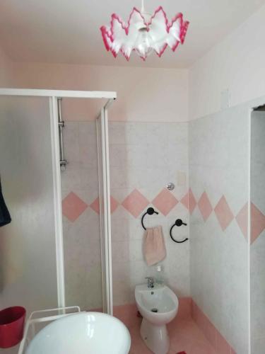 a bathroom with a shower and a toilet and a sink at Holiday home in Ceppo Morelli - Piemont 52109 in Ceppo Morelli