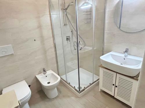 a bathroom with a shower and a toilet and a sink at Studio in Lido di Jesolo 54508 in Lido di Jesolo