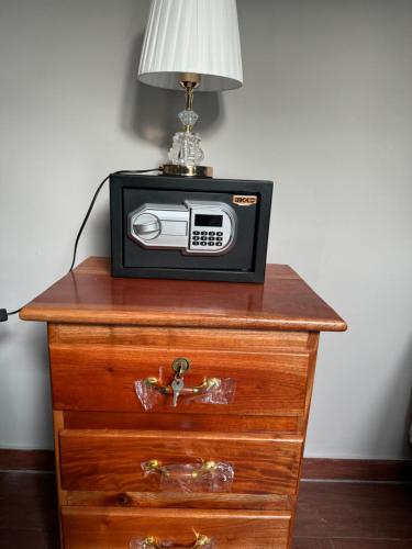 a small radio sitting on top of a dresser at Container house in La Esmeralda