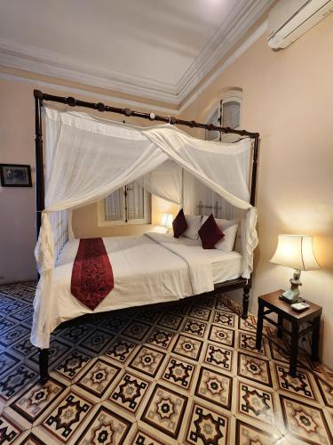 Ένα ή περισσότερα κρεβάτια σε δωμάτιο στο La Villa