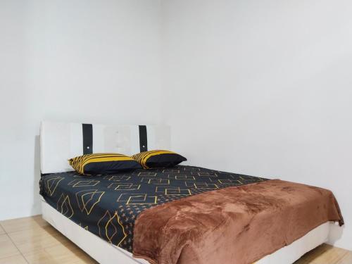Una cama o camas en una habitación de Hally Batulayang