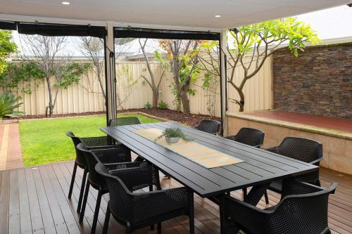 a black table and chairs on a patio at Town Central Entertainers Delight in Busselton