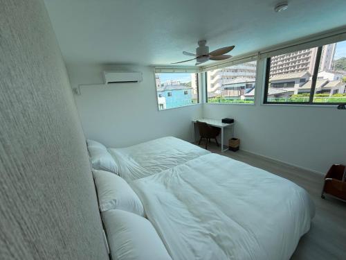 Cama o camas de una habitación en 御宿ガーデンヴィラ