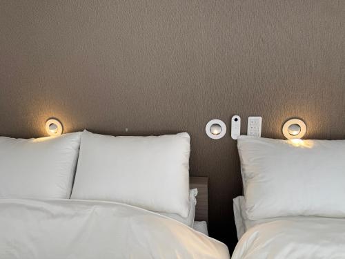 Cama o camas de una habitación en 御宿ガーデンヴィラ