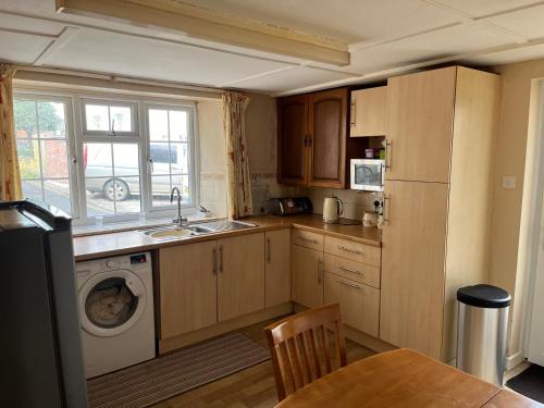 Køkken eller tekøkken på Maureen's Cottage