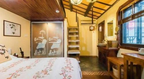 Ένα ή περισσότερα κρεβάτια σε δωμάτιο στο The Courtyard Suzhou Inn Hemu Branch