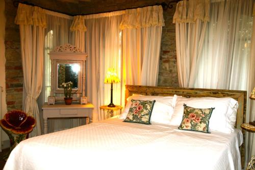 Ένα ή περισσότερα κρεβάτια σε δωμάτιο στο Villa Organi