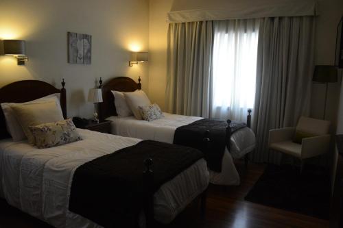 Кровать или кровати в номере Hotel Sao Jose