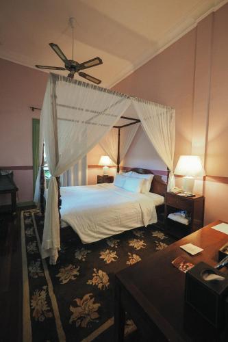 Ένα ή περισσότερα κρεβάτια σε δωμάτιο στο Villa Maly Boutique Hotel