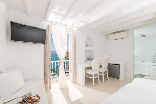 A bed or beds in a room at Little Venice Suites