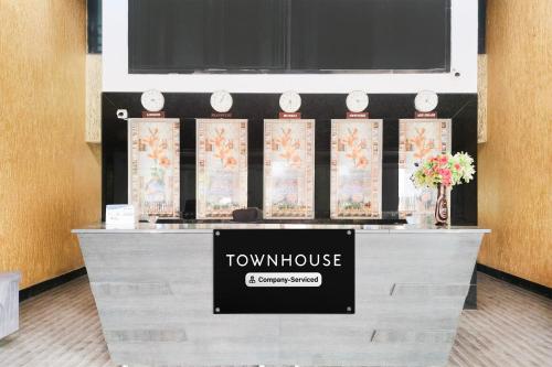 a room with a counter with a townulse sign on it at Super Townhouse Bharuch Near Railway Station Formerly Hotel Kohinoor in Bharuch