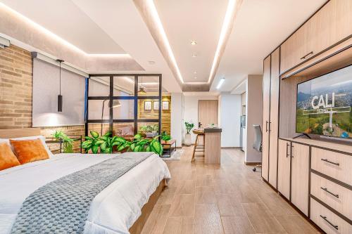 a bedroom with a bed and a large window at Edificio Habitare Cristales Cali 2 in Cali