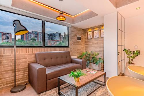 a living room with a couch and a table at Edificio Habitare Cristales Cali 2 in Cali
