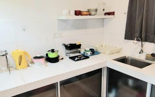 a kitchen with a sink and a counter top at YUYU B2 Honeymoon WiFi Genting highland in Genting Highlands