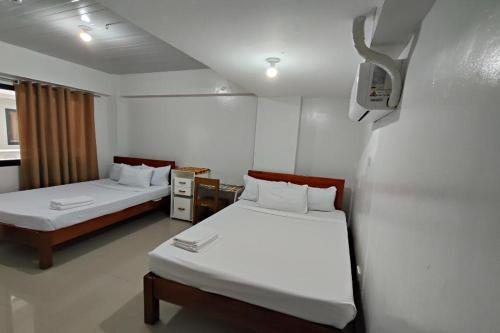 Postel nebo postele na pokoji v ubytování Benediktus Pilgerhaus Inn Vigan