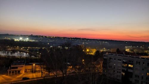 a view of a city at night with lights at Magaslak Apartman in Kaposvár
