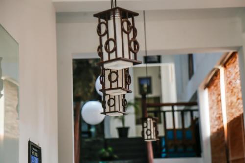 a chandelier hanging from theoyer of a house at Hotel Silver Horse Dambulla in Dambulla