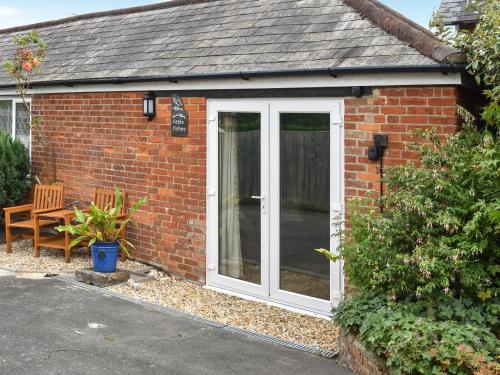 a red brick house with a white door at Little Fishes in Ryde