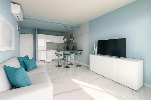 a living room with a couch and a flat screen tv at Bellosguardo in Poggi