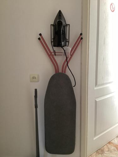 a snowboard hanging on a wall next to a door at Willa Rodzinna in Mielno