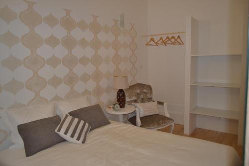 Tempat tidur dalam kamar di Apartamento LM Ribeira