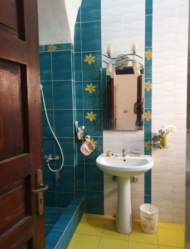 a bathroom with a sink and a mirror at Sou Villa in El Alamein