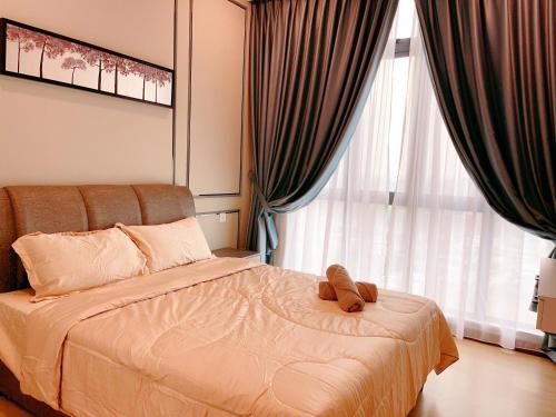 Ένα ή περισσότερα κρεβάτια σε δωμάτιο στο GYDEN STAYCATION #Green Haven near Senibong&Regency