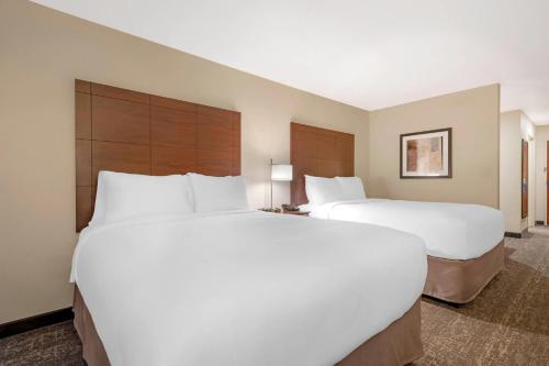 two large white beds in a hotel room at Comfort Inn & Suites Morgan - South Ogden in Morgan
