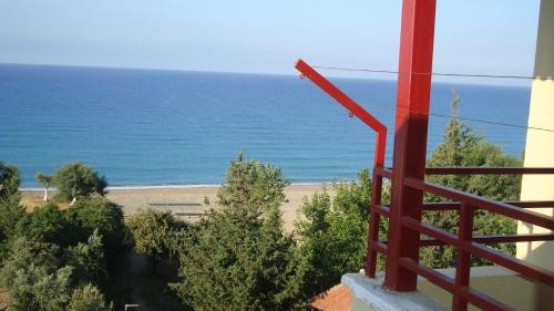 a view of the ocean from a balcony at Sercan Apart in Kızılot