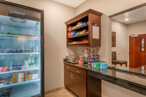 a kitchen with an open refrigerator with food at Comfort Inn & Suites Morgan - South Ogden in Morgan