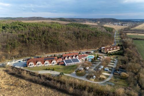 an aerial view of a house with a solar farm at Thermal Park Hotel Egerszalók in Egerszalók