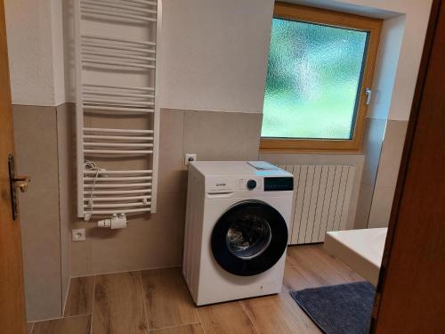 a washing machine in a bathroom with a window at Farmhouse in Ramsau near Ski Slopes in Ramsau im Zillertal