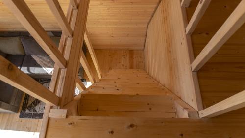 an overhead view of a wooden staircase in a house at Pinehouse Urtkhva in Surami 