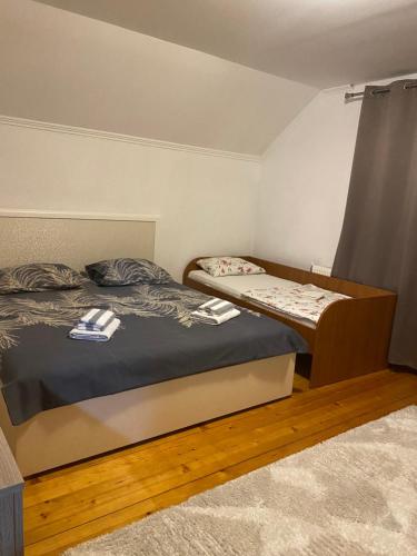 a bedroom with two beds in a room at Lejna Guest House in Plav