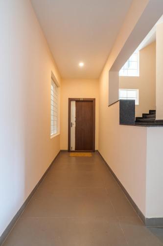 a hallway of a house with a door at Everest Serenity Service Apartments in Coimbatore
