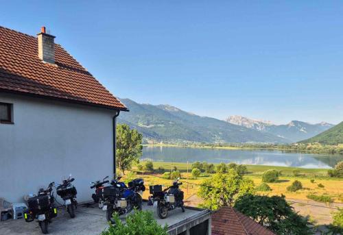 a group of motorcycles parked next to a building at Lejna Guest House in Plav