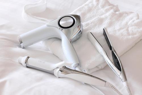 a pair of scissors sitting on top of a white cloth at Hotel Nikko Nara in Nara