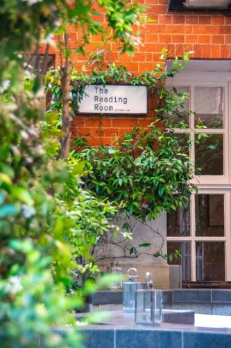 a sign for the reading room on a brick building at Top Quality 2 Bed 1 Bath Apartments For Contractors By REDWOOD STAYS in Reading
