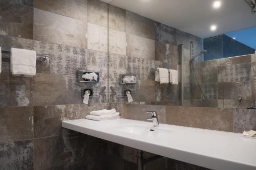 Koupelna v ubytování City-Hotel