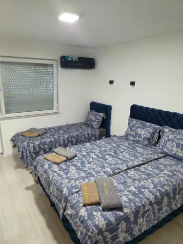 Postel nebo postele na pokoji v ubytování Apartman Jorgic