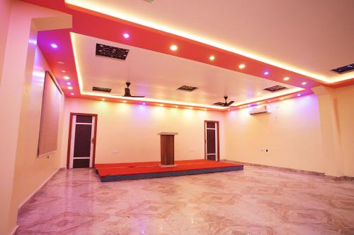 a large room with a podium in the middle at Holiday Beach Resort !! Beach Distance 50 Mts !! in Mandarmoni