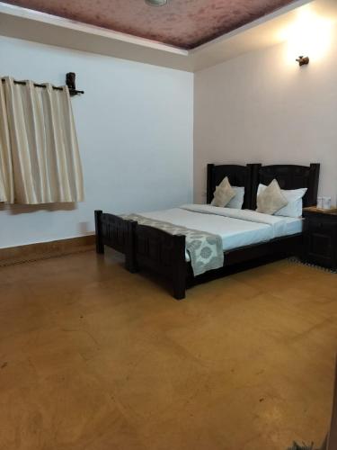 a bedroom with a large bed in a room at Jaisalmer Elite Castle in Jaisalmer