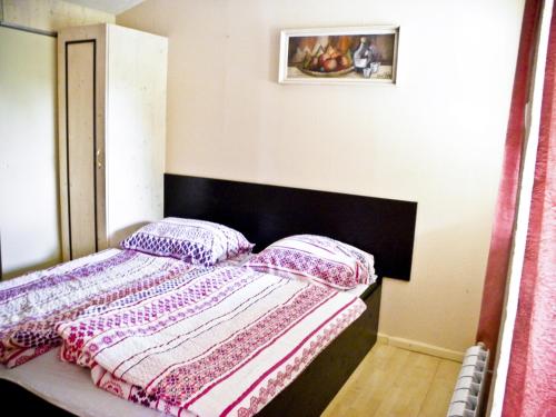 a bed with two pillows on it in a room at Kempink U Šerifa in Protivín
