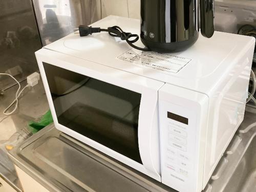 a microwave oven with a blender on top of it at lol 2 105 in Hakodate