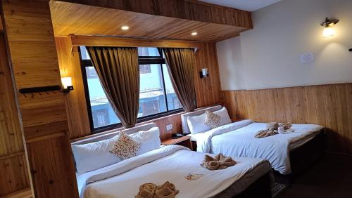 Ένα ή περισσότερα κρεβάτια σε δωμάτιο στο Hotel Golden Orchid