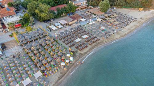 an aerial view of a beach with umbrellas and the water at Isminis country house in Vergia